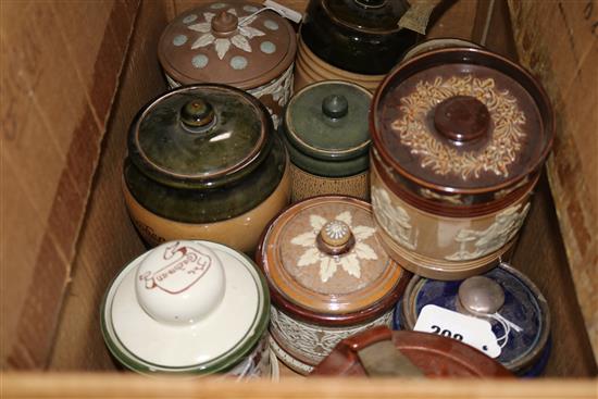 Twelve Doulton tobacco jars and covers, various designs